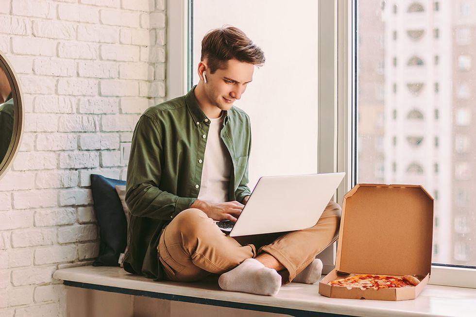 Man looks for a job on his laptop