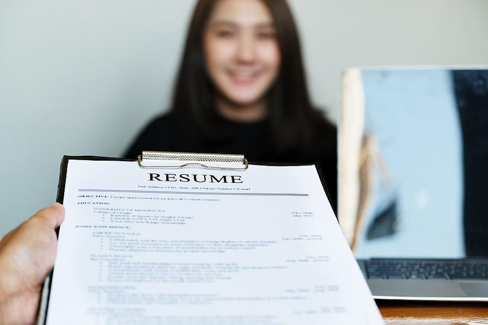 Hiring manager looks at interesting job candidate during an interview