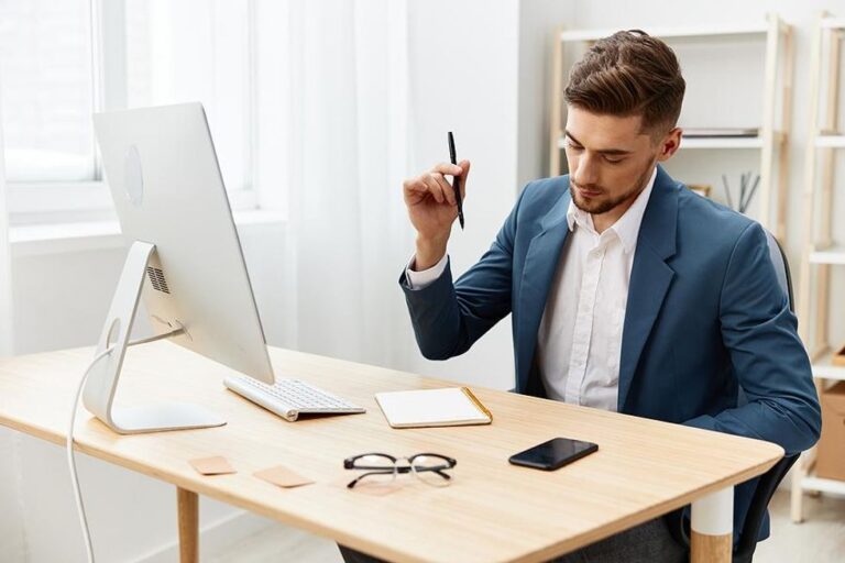 Man at computer prepares for a job interview