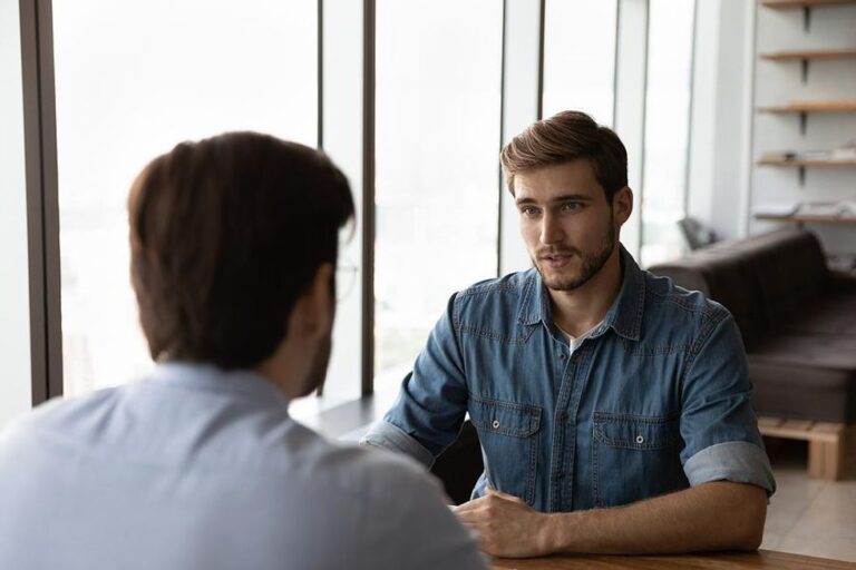 Man answers "Why are you interested in this job?" during an interview