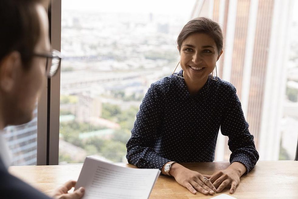 Woman asks the hiring manager a question during her job interview