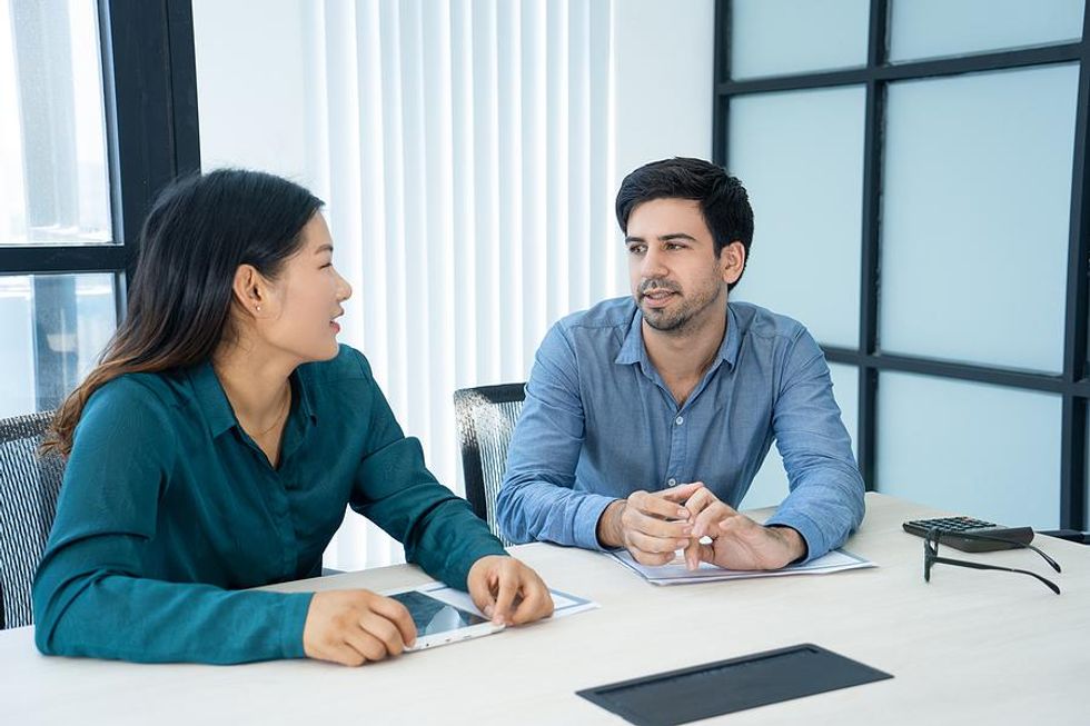 Man talks to his boss about stress