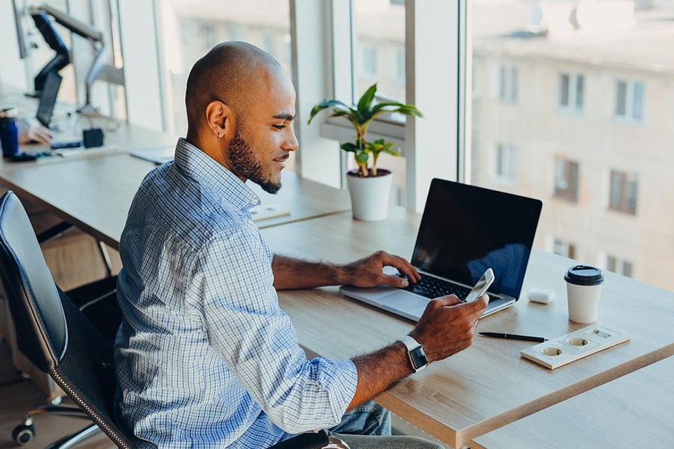 Man on phone leverages his network to learn how to upskill