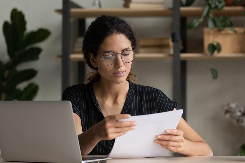 Recruiter reads a cover letter from a job candidate