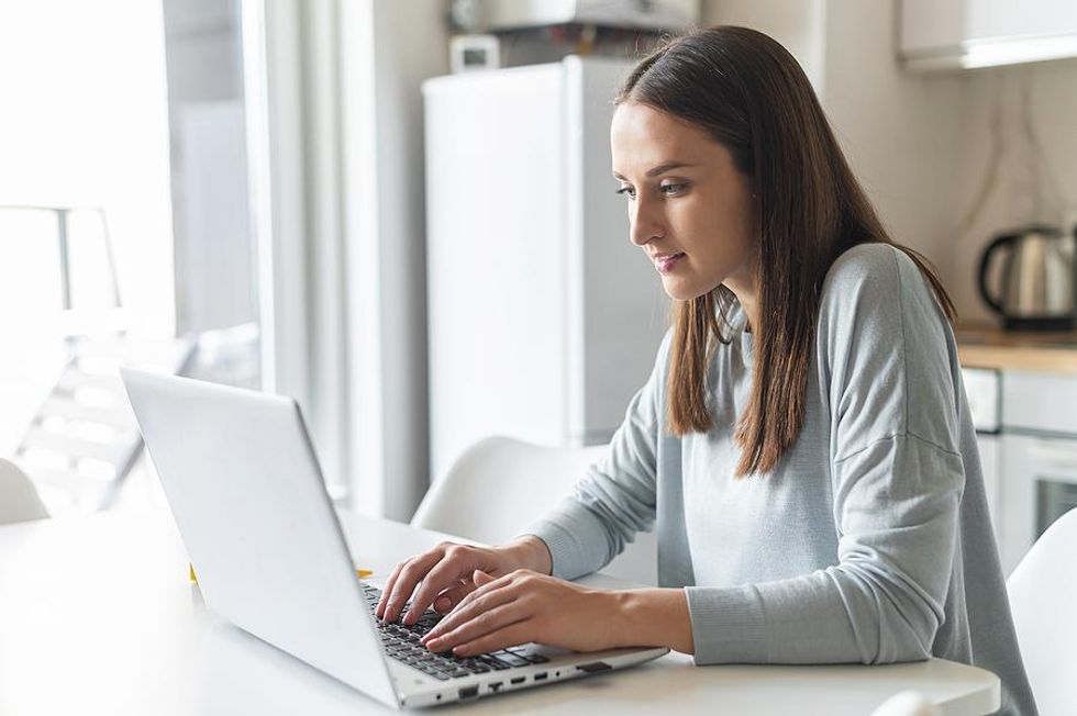 Woman typing on laptop