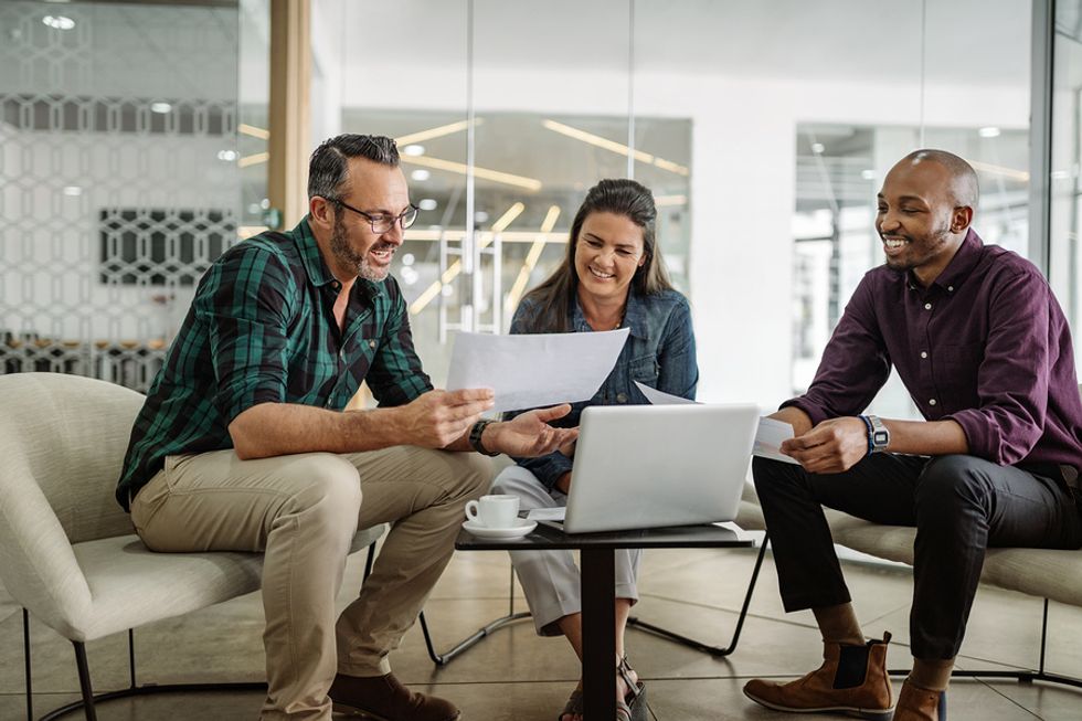 Coworkers meet to talk about a project at work