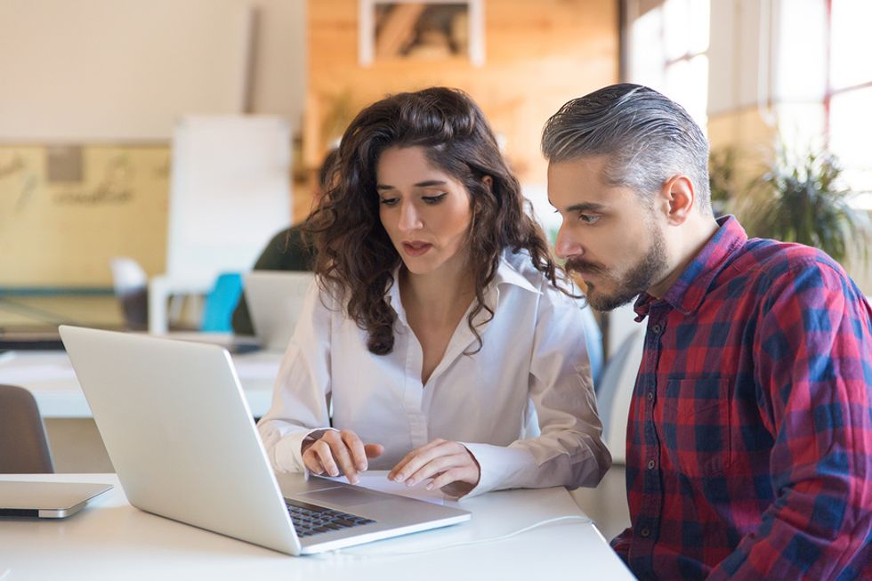 Woman stands out at work by helping her coworkers