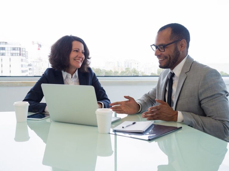 A career coach works with a client on their resume