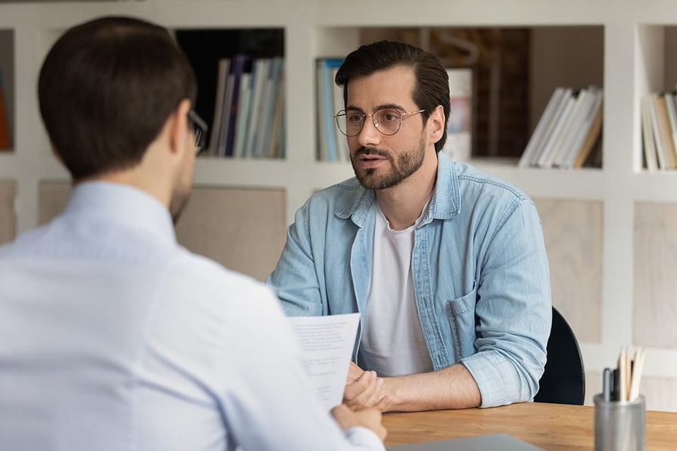 Man asks a question during an interview