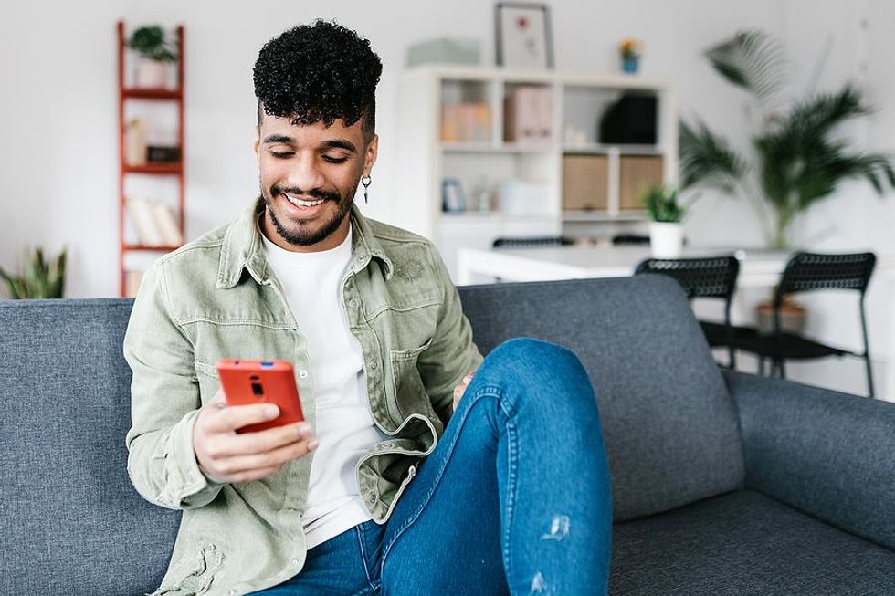 Man checks LinkedIn on his phone