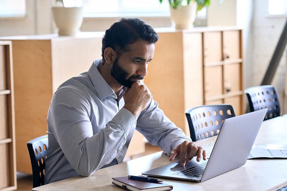 Man looks something up on his laptop