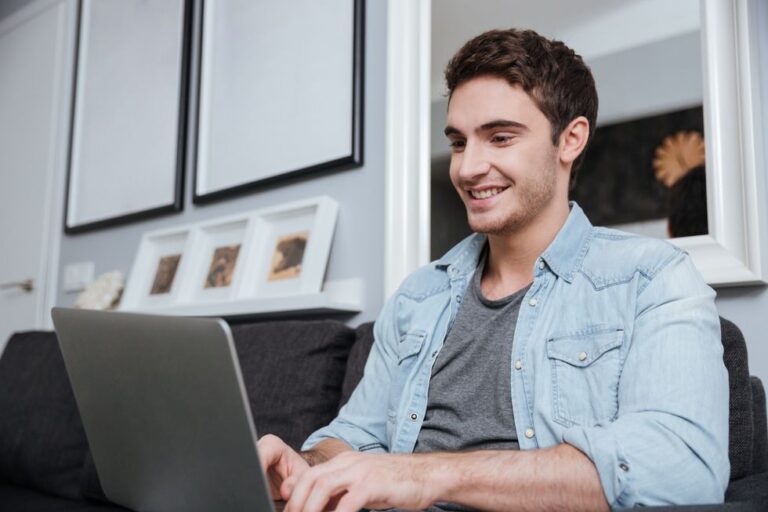 Job seeker on laptop researching before phone interview