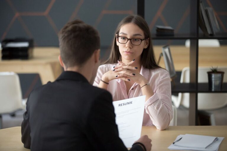 Professional woman answers a behavioral question during a job interview