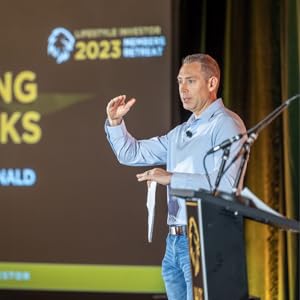 Justin Donald Speaking on Stage