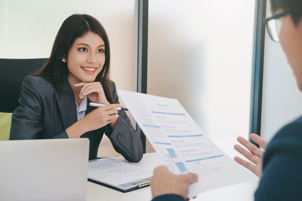 Hiring manager listens to a job candidate answer the "What makes you unique?" interview question