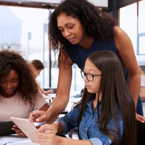 teacher helping student